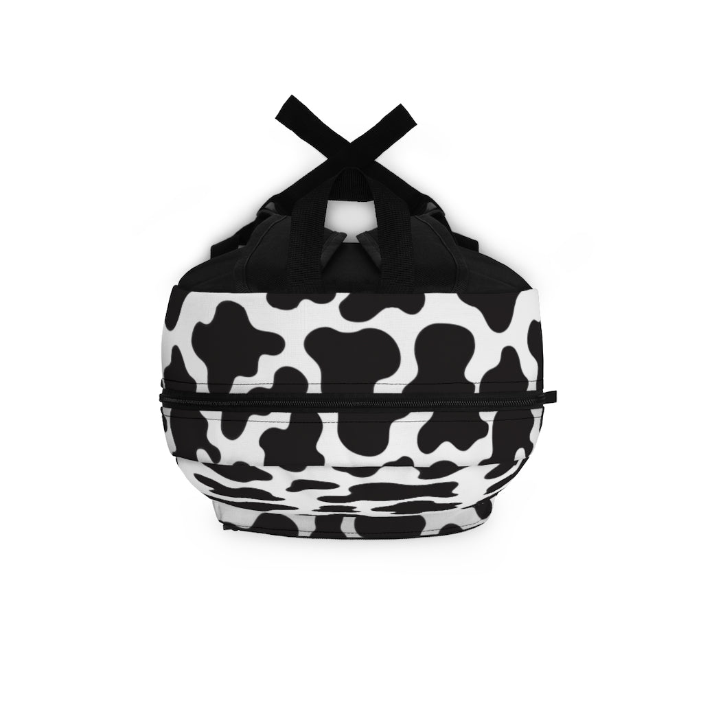 top view of cow print backpack in black and white