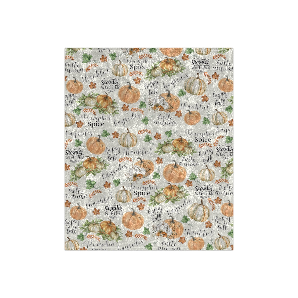 flat view of the autumn pumpkin patch blanket in white with orange pumpkins