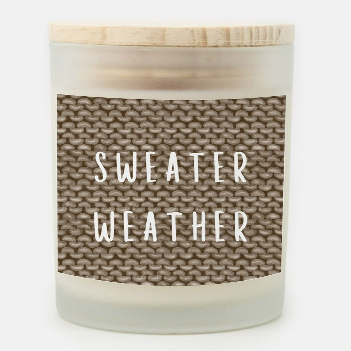 fall candle with a knit pattern with sweater weather phrase