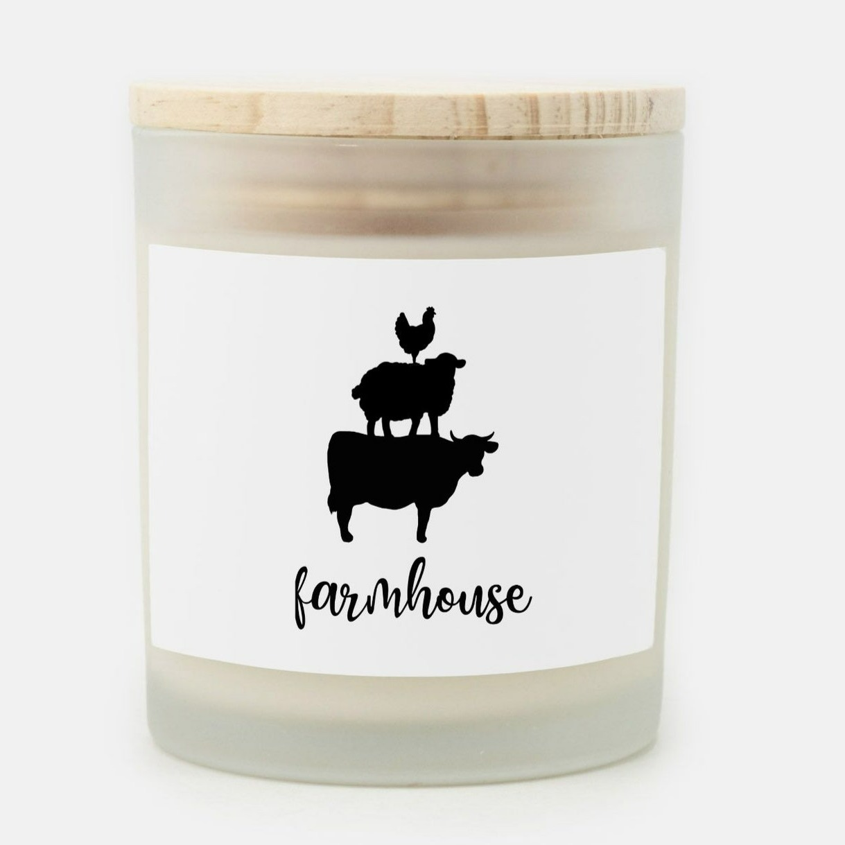 farmhouse hand poured candle with farmhouse cow, pig and rooster stacked